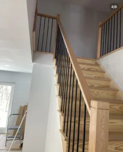 Wooden staircase leading to the upper floor with clean, minimalistic design.