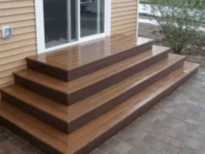 Wooden deck stairs construction completed with polished brown finish.