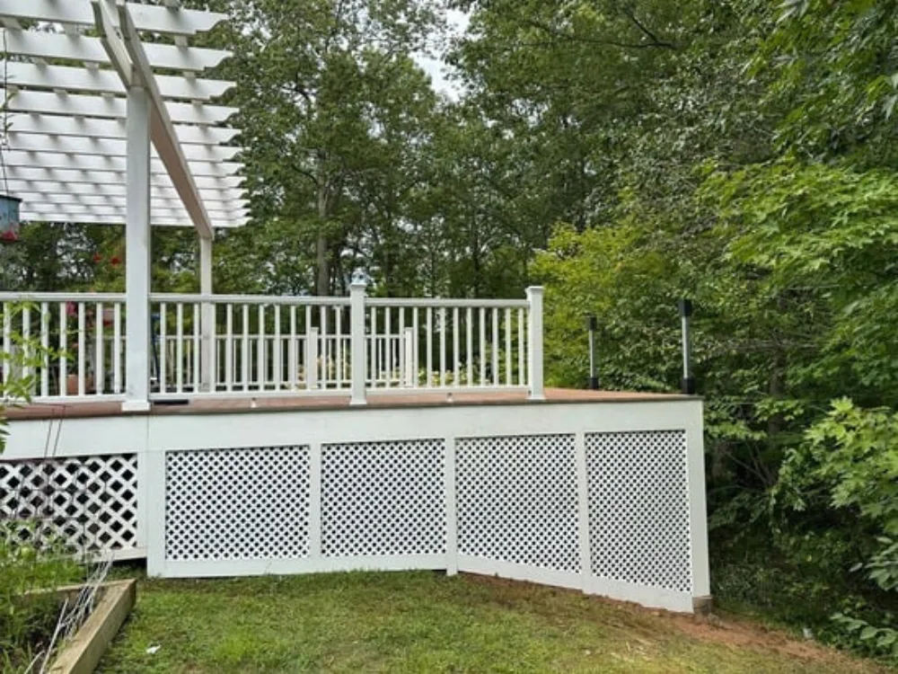 Decking Pergola Project with white lattice skirting and railing