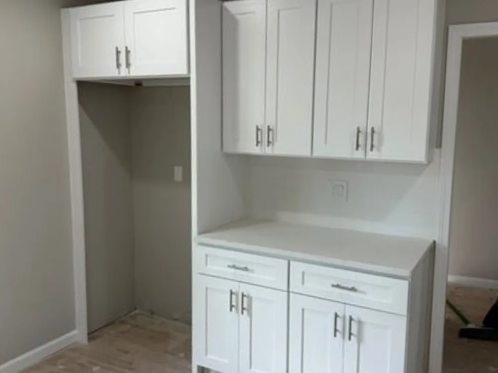 White shaker cabinets with additional storage installed for a modern, spacious kitchen.