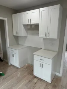 White shaker cabinets installed in the kitchen with clean lines and modern design.