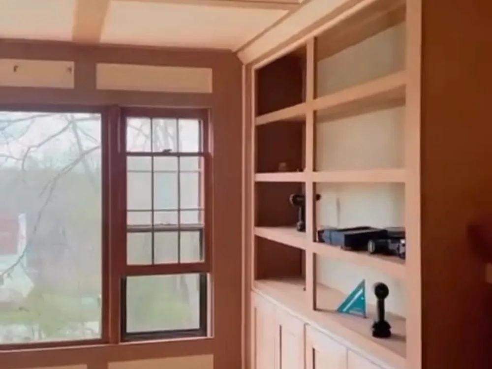 Custom built-in woodwork highlighting shelving details and interior finishes