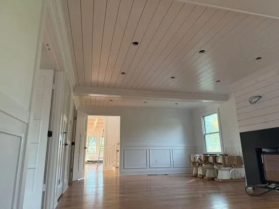 Living area ceiling paneling completed in Full-Home Finish
