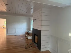 Fireplace wall paneling progress in Full-Home Finish
