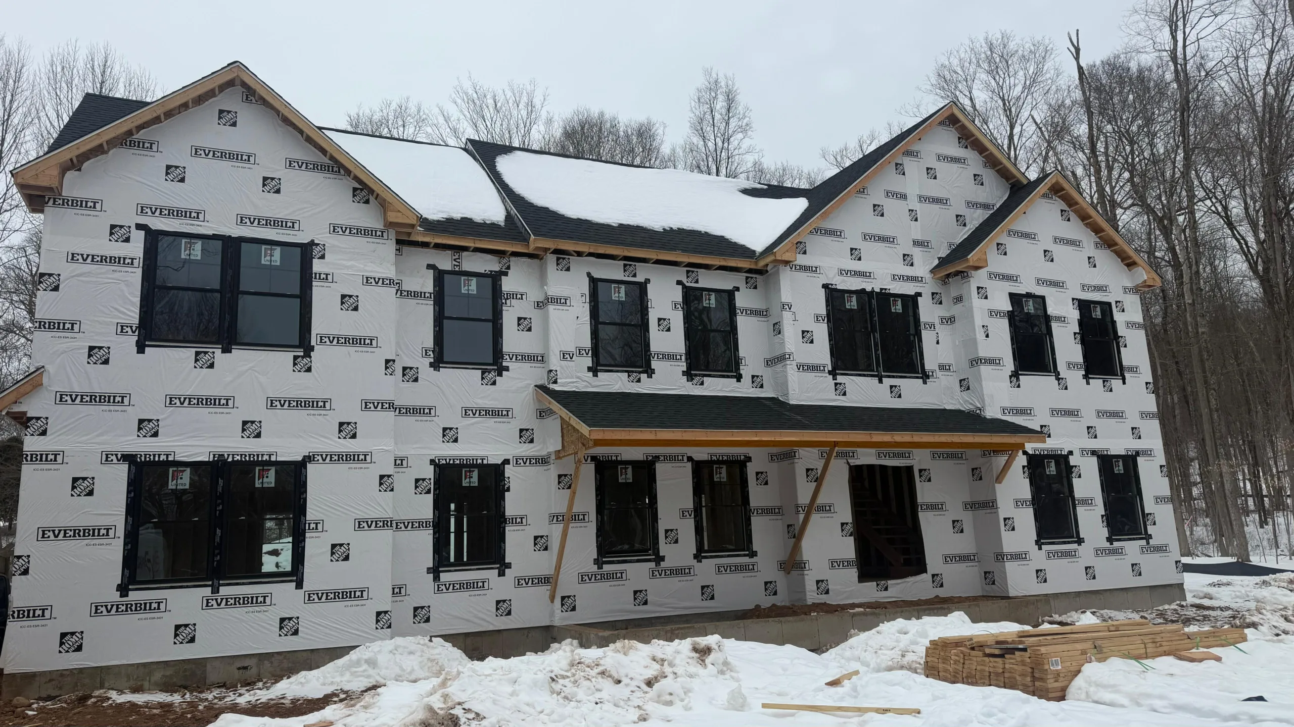 Close-up of the architectural detailing and roofline of a new construction Guilford CT in winter.